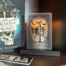 Load image into Gallery viewer, The Reader Skeleton Tarot Card Bookshelf Plaque
