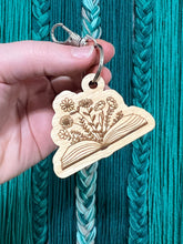 Load image into Gallery viewer, Wood Engraved Floral Book Keychain
